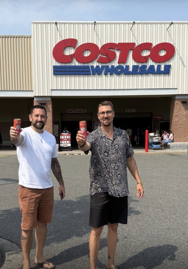 Holding Bali Water cans outside a Costco warehouse